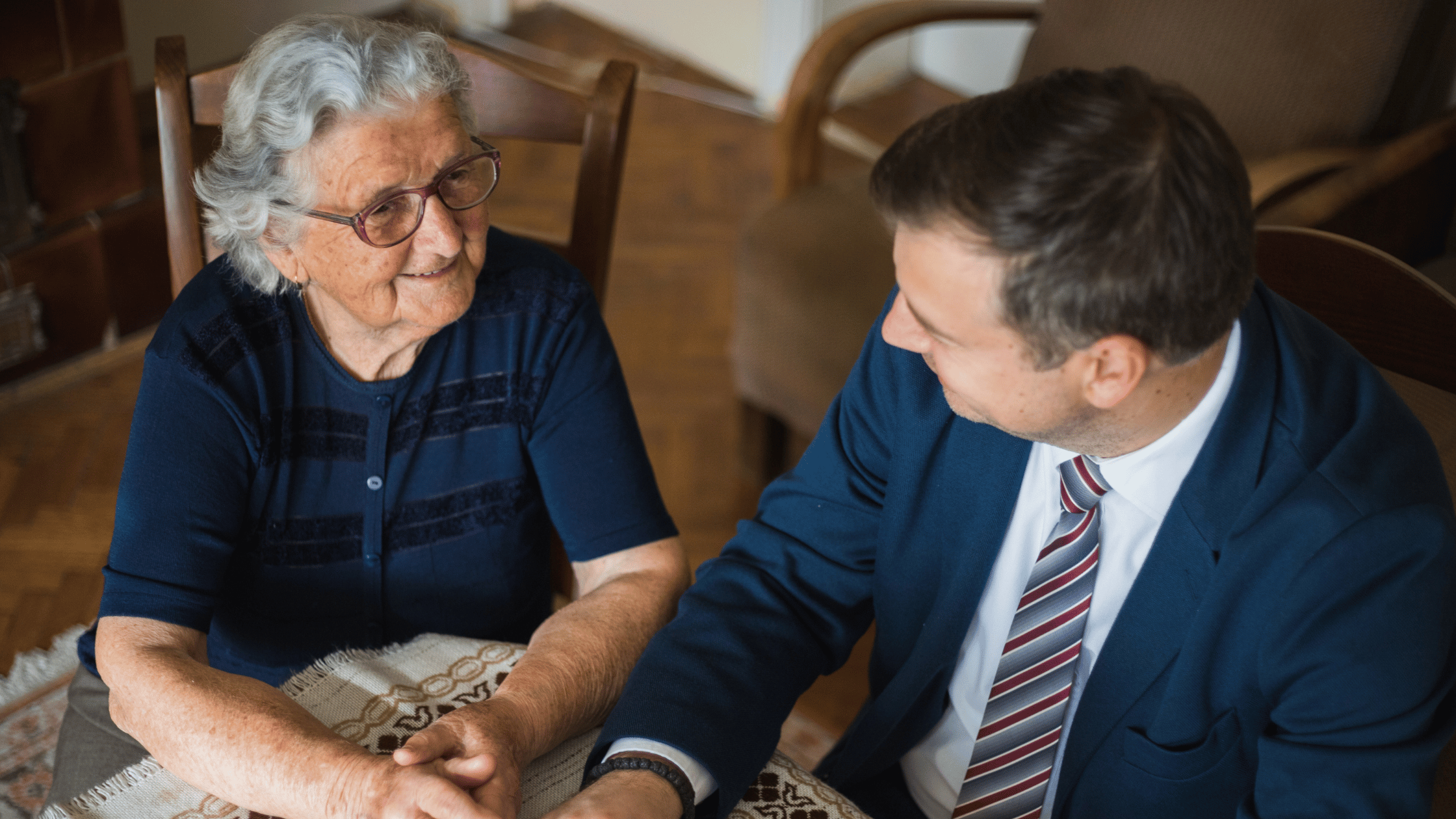 senior woman with attorney discussing home sale