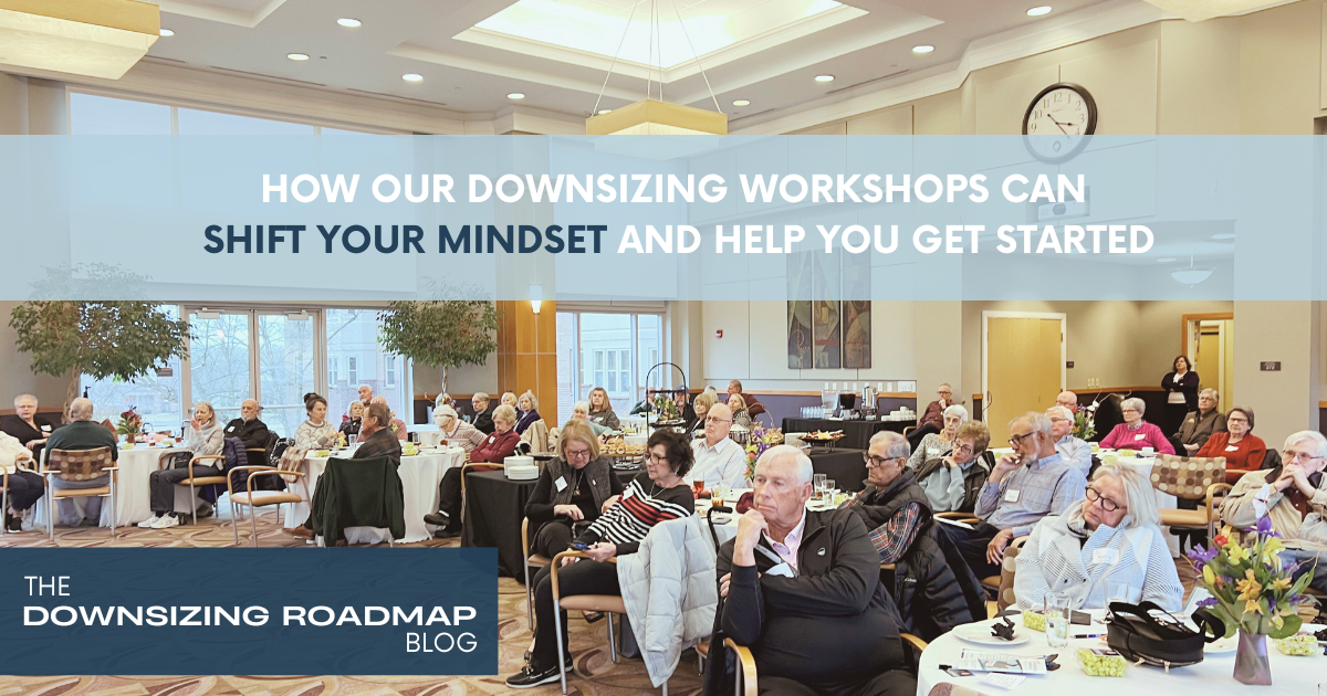 People attending a downsizing workshop, smiling and engaged in discussion