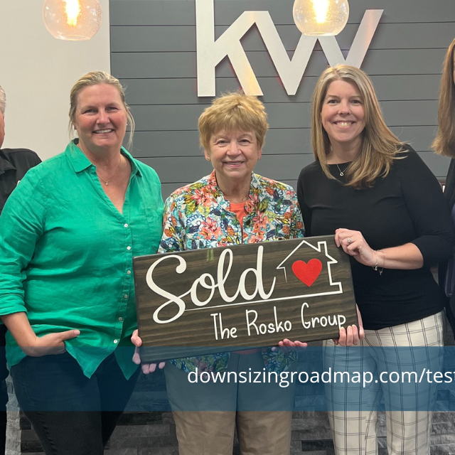 Smiling client with members of Downsizing Roadmap
