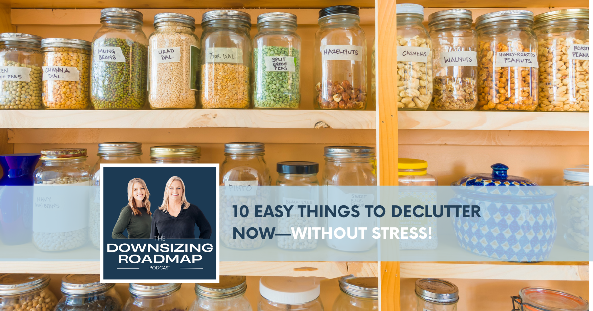 Person decluttering small household items like containers, cords, and spices on a clean kitchen counter.