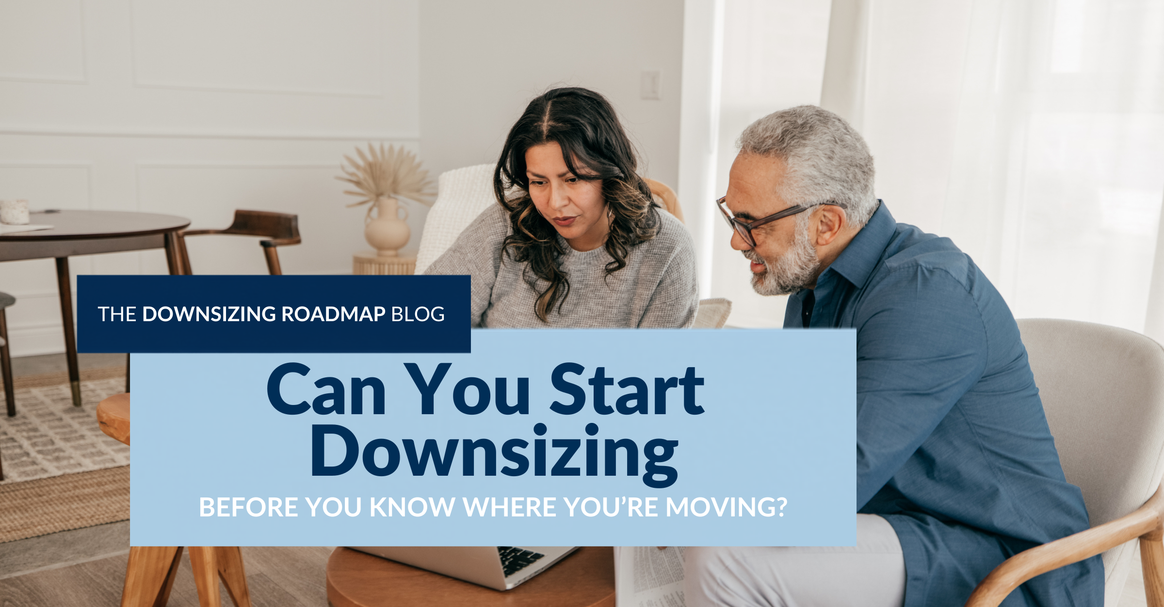 Two people reviewing plans together as they discuss how to start downsizing before choosing their next home