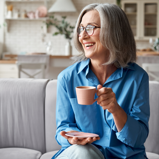 woman drinking a cup of tea discussing downsizing